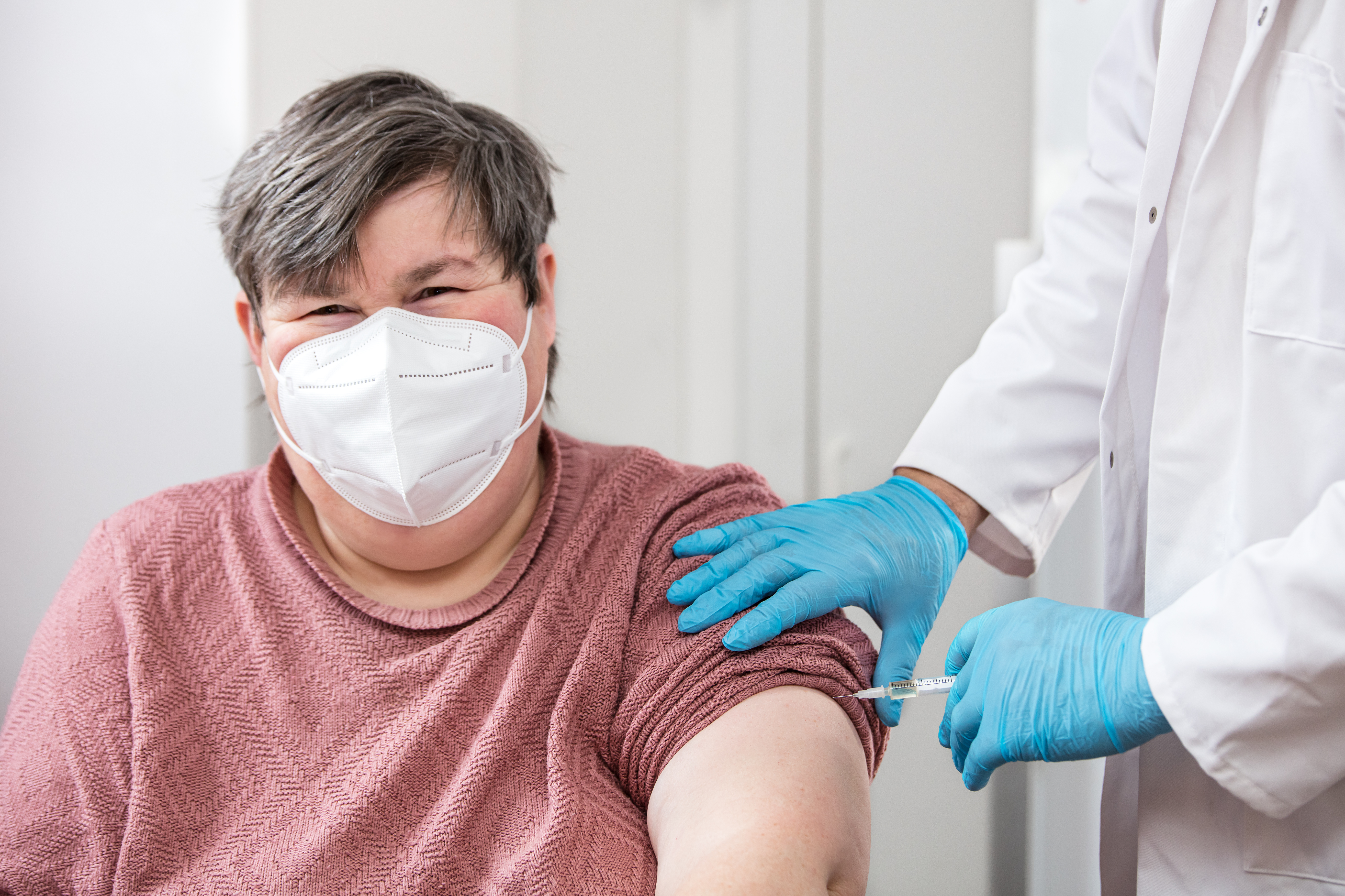 Adult white woman receiving vaccine